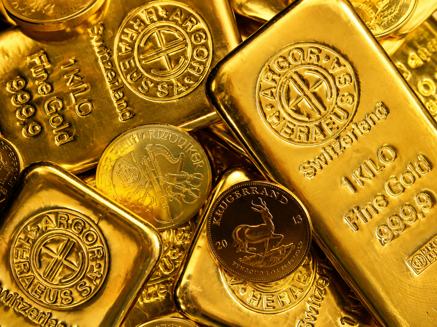 Gold bars and coins representing the global gold market